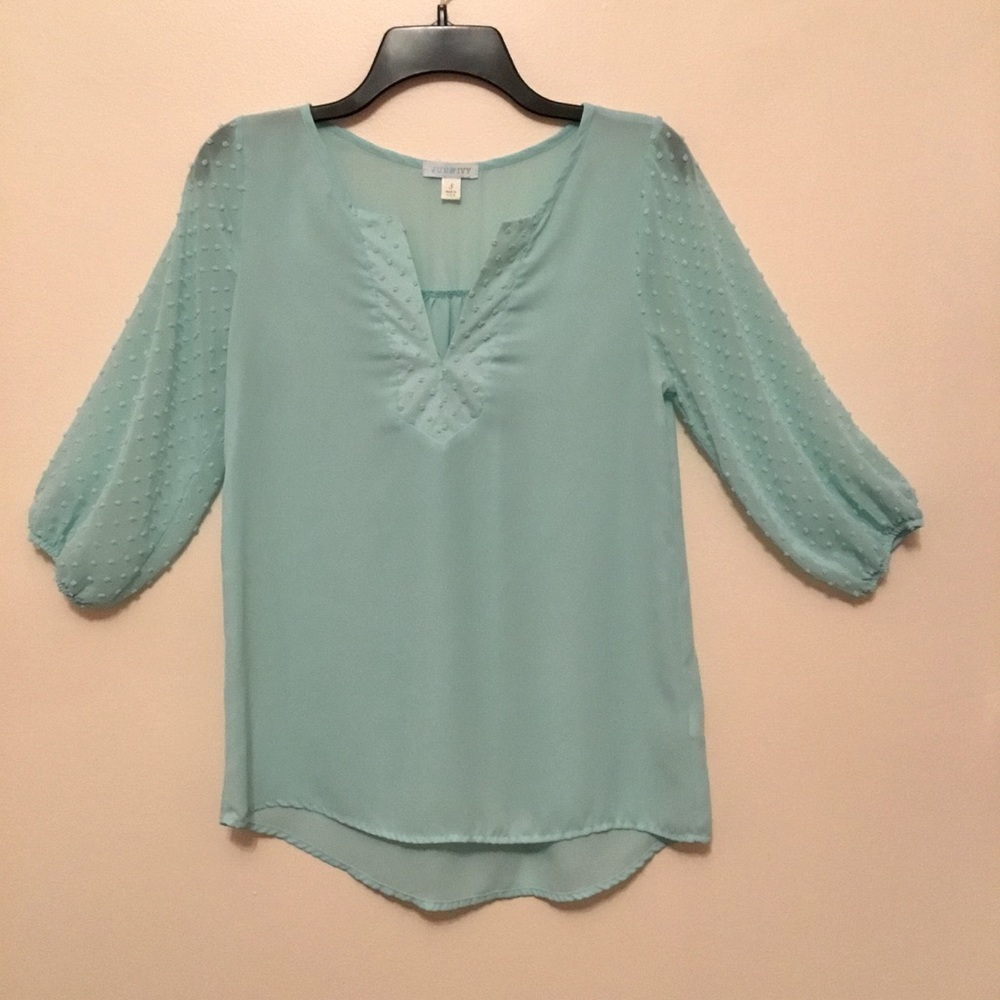 Super soft summer top w/dotted swiss sleeves in Aqua color.
